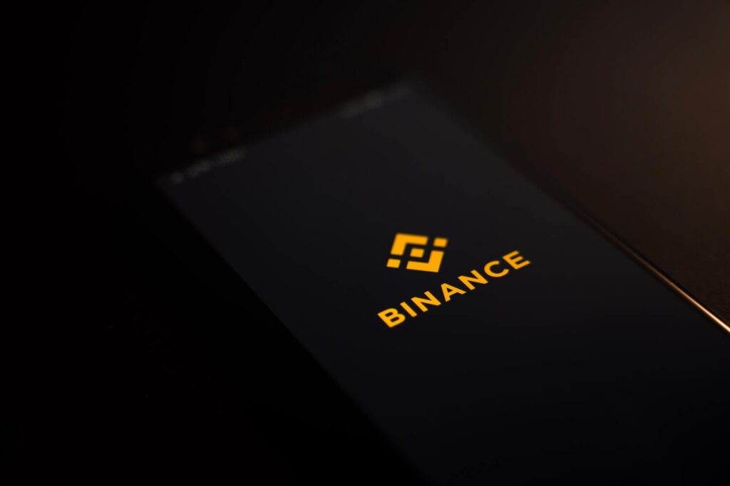 A smartphone displaying the logo of Binance